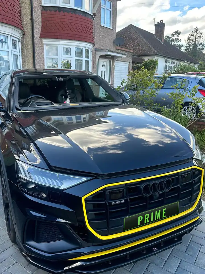 Before: black Audi Q8 on a driveway in Barnet with the damaged windscreen taken out