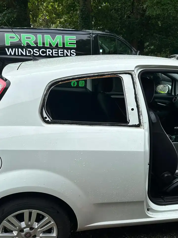 Before: white Fiat Punto in an Enfield car park with the broken rear side window taken out