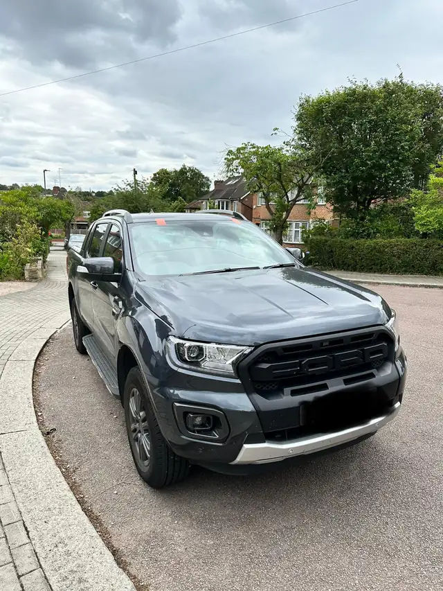 Grey Ford Ranger Wildtrak in a quiet Barnet close with its replacement windscreen fitted