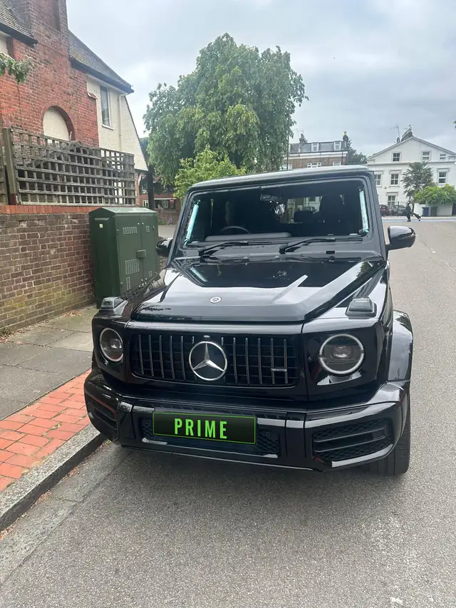 Black Mercedes AMG G 63 parked on a residential street in Barnet during a mobile windscreen job
