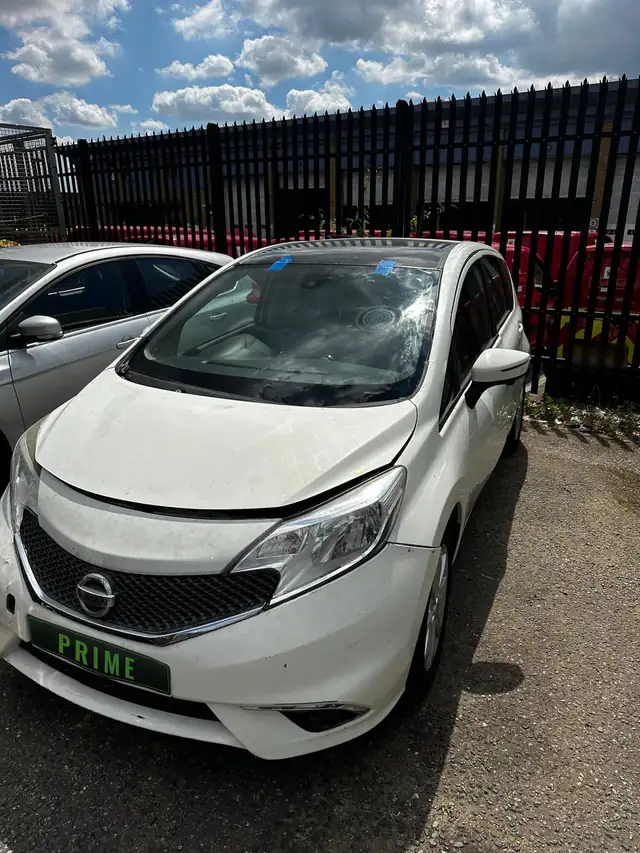 The same Nissan Note in the Barking yard with its new windscreen taped in place