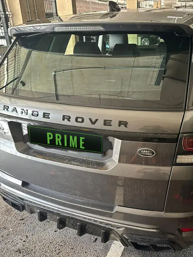 Grey Range Rover Sport in a covered car park with its new rear screen fitted