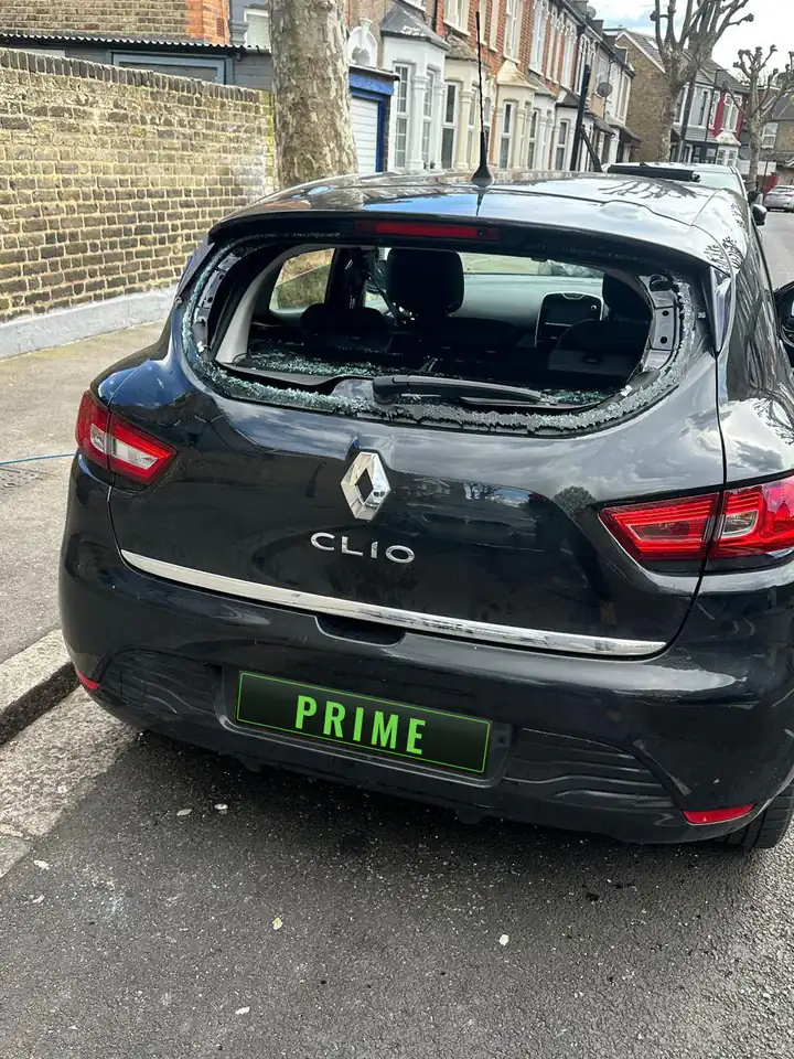 Before: black Renault Clio with its rear screen shattered
